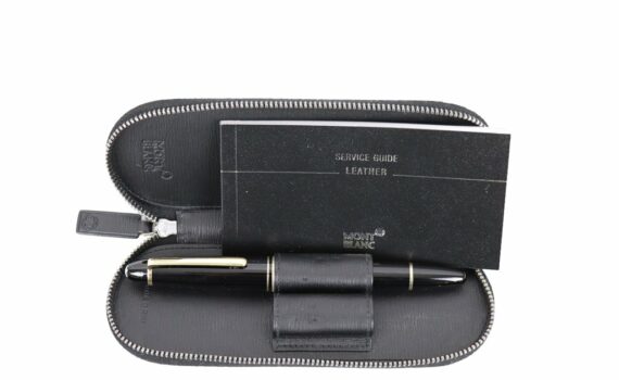 Montblanc pen set in a black leather zip case with a service guide booklet labeled “Leather” beside the pen holder.